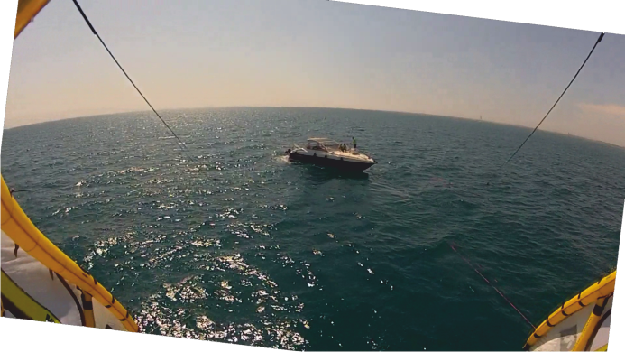 Kite pulls motor boat yacht
